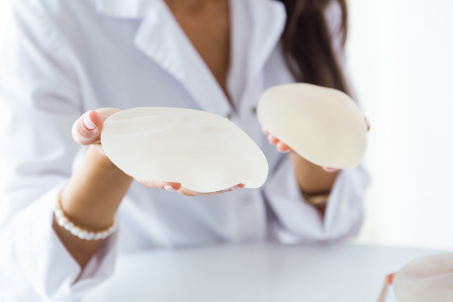 doctor checking silicone size to patient